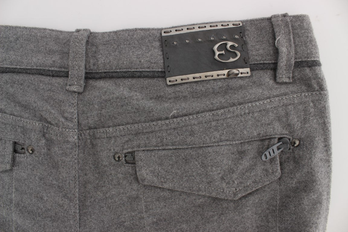 Pair of gray denim jeans with metal zippers and a leather patch on the back right side