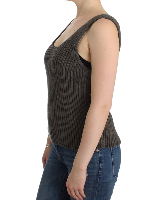 Woman wearing a knit vest over a tank top