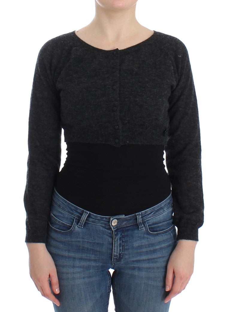 Woman wearing black sweater and blue jeans