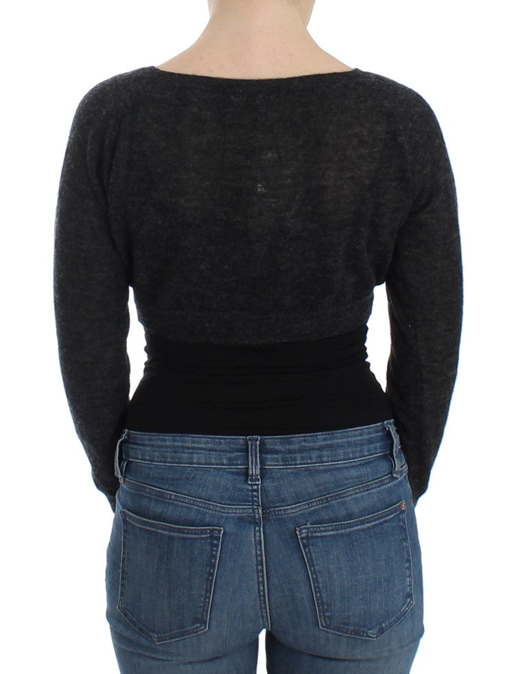 Woman wearing black top and blue jeans