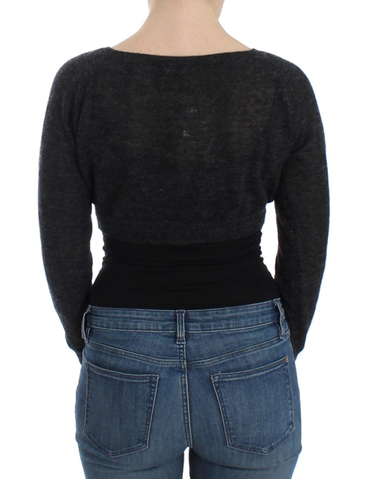 Woman wearing black top and blue jeans