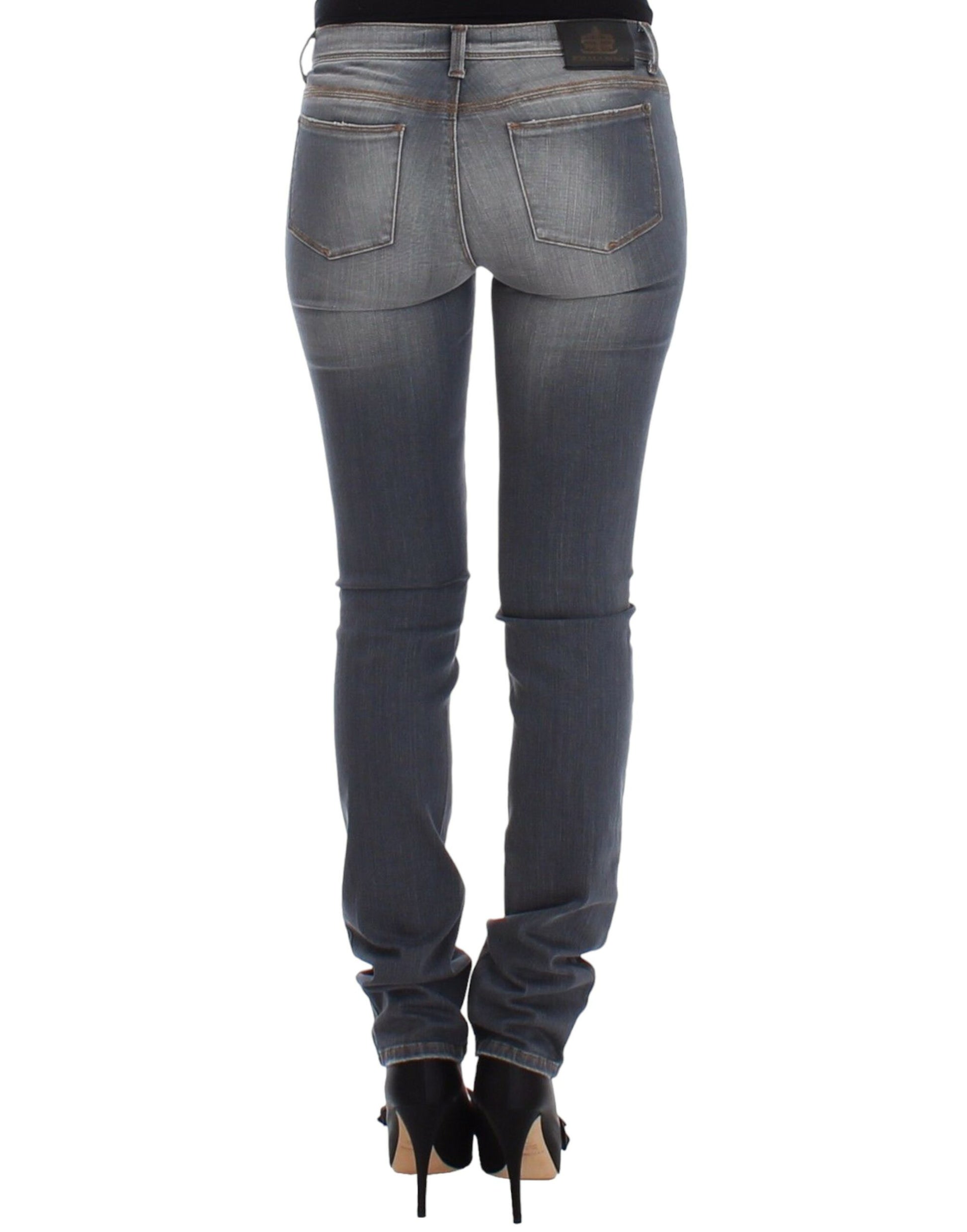 Pair of women's jeans with faded wash and visible stitching