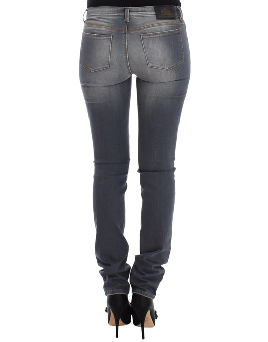Pair of women's jeans with faded wash and visible stitching