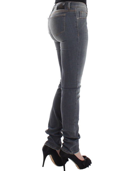 Woman wearing blue jeans and black high heels