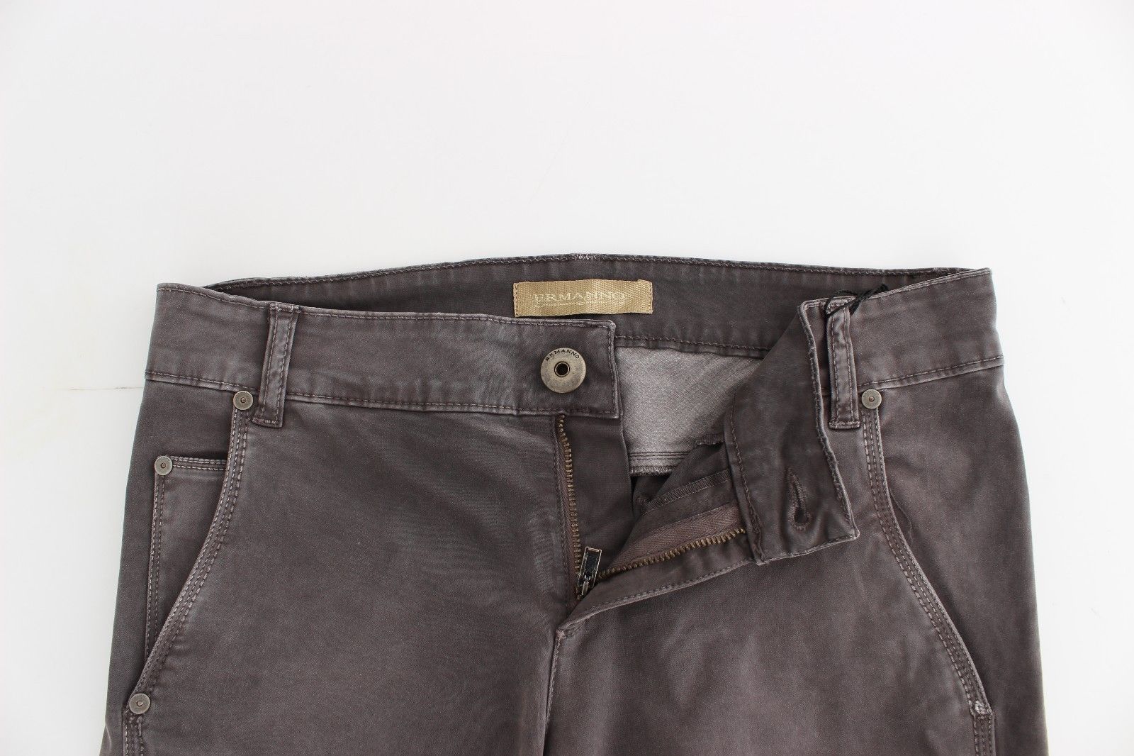 Pair of dark wash jeans with button closure and zipper fly