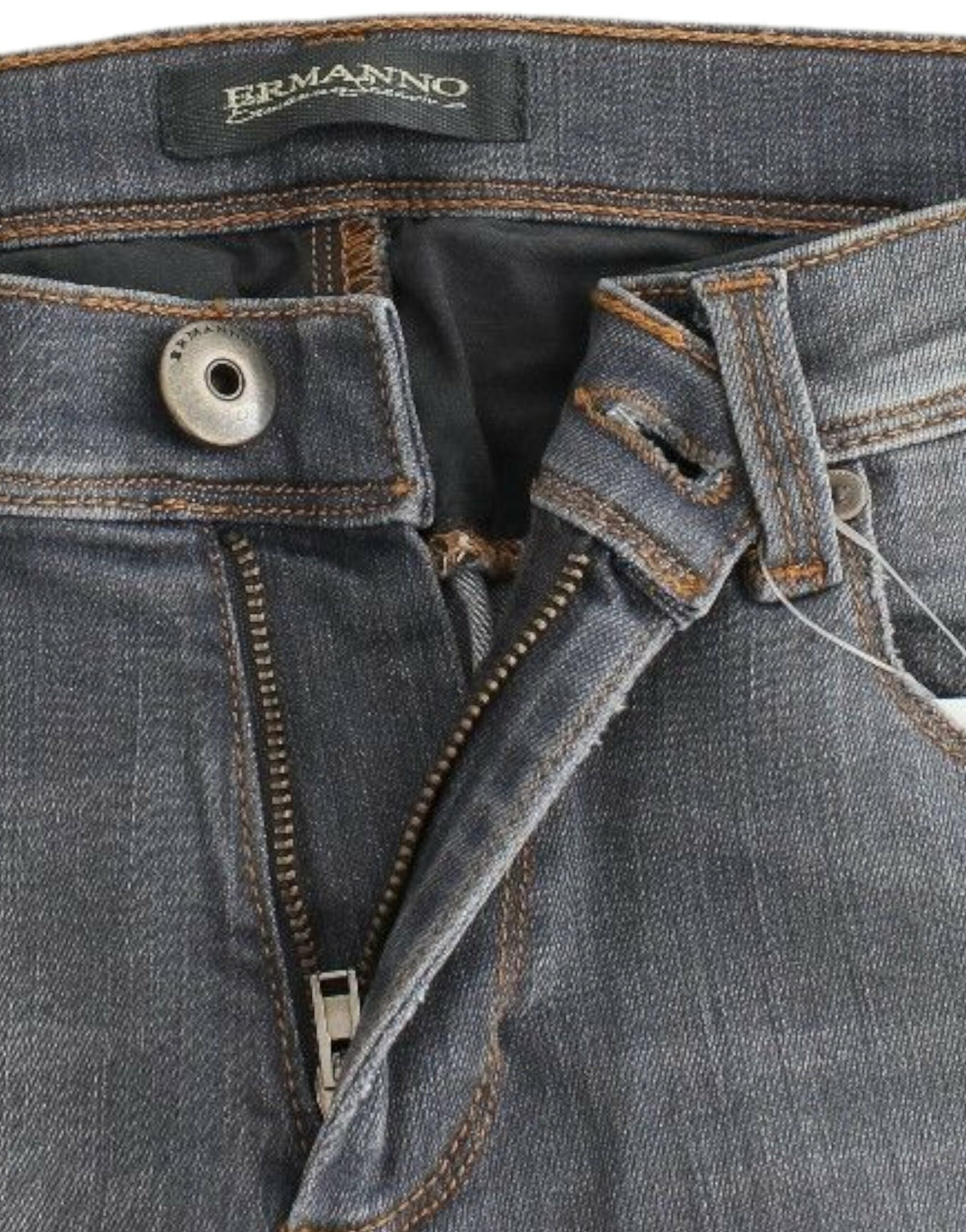 Pair of blue jeans with zipper and button closure