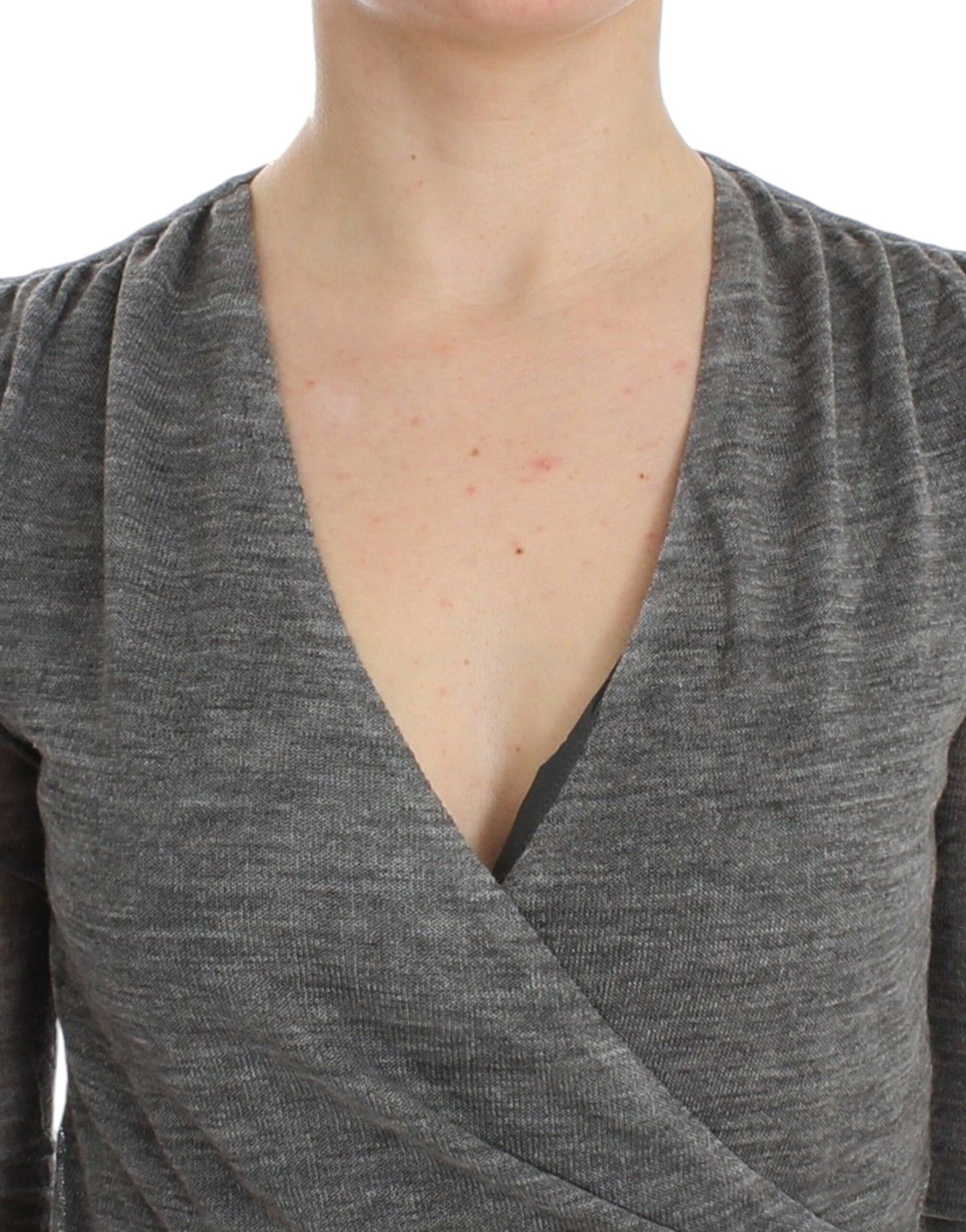 Woman wearing a gray sweater vest