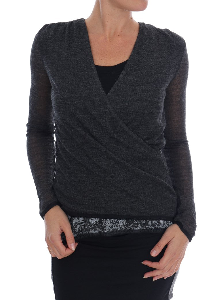 Woman wearing a dark gray sweater with long sleeves
