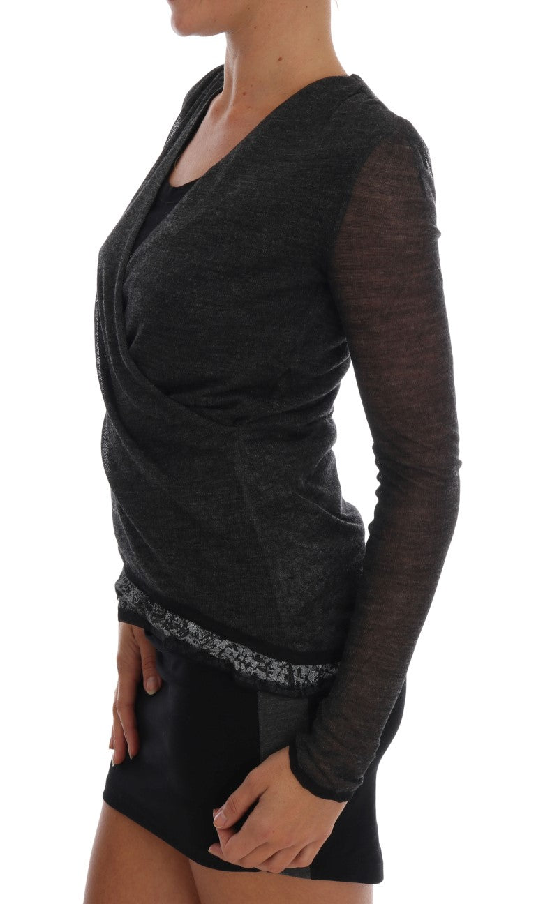 Woman wearing a black long sleeve top and skirt