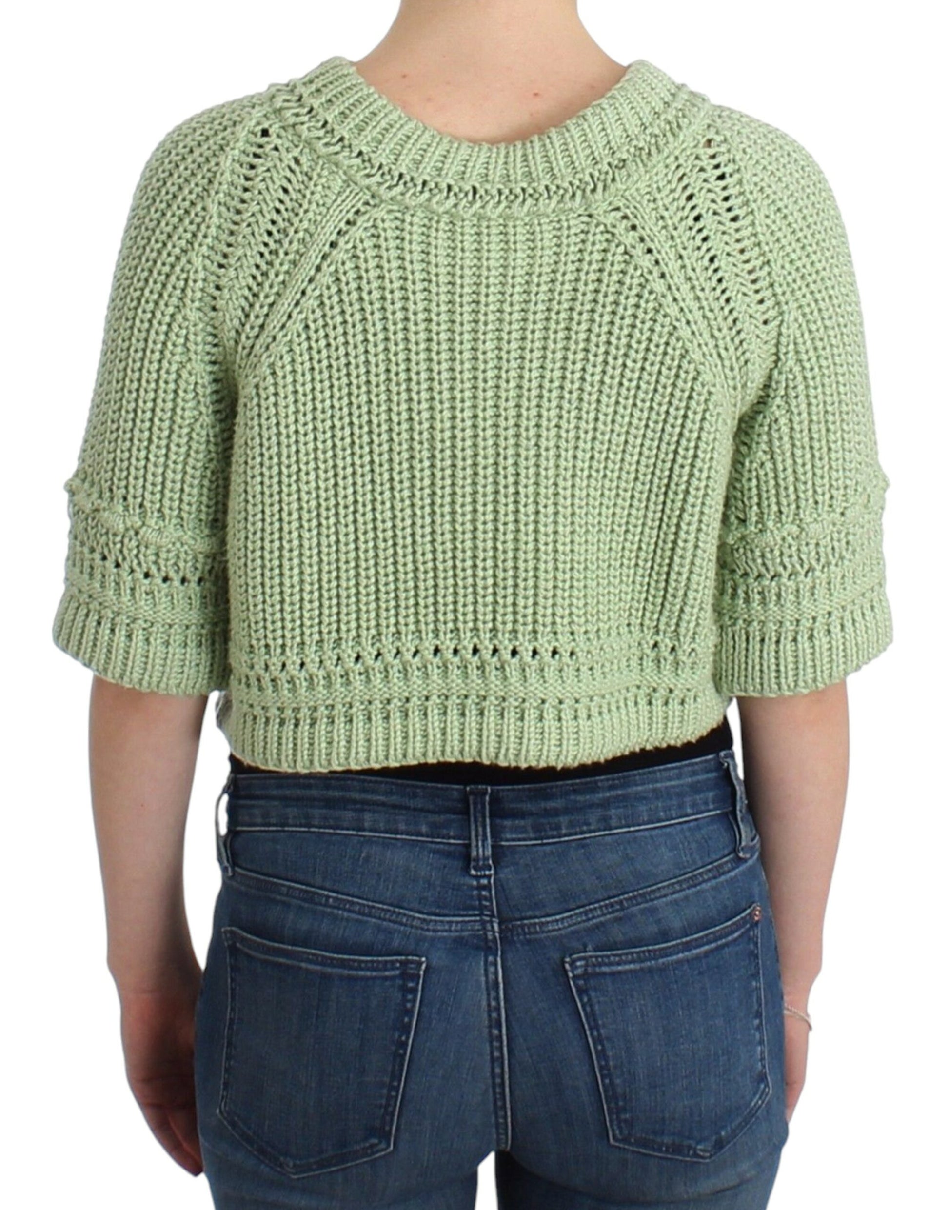 Woman wearing crocheted sweater and jeans