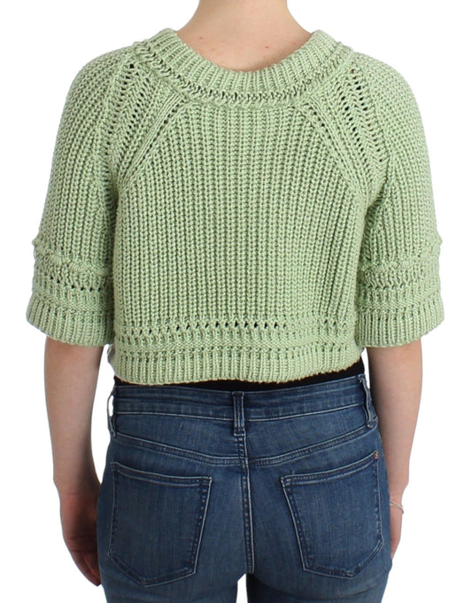 Woman wearing crocheted sweater and jeans