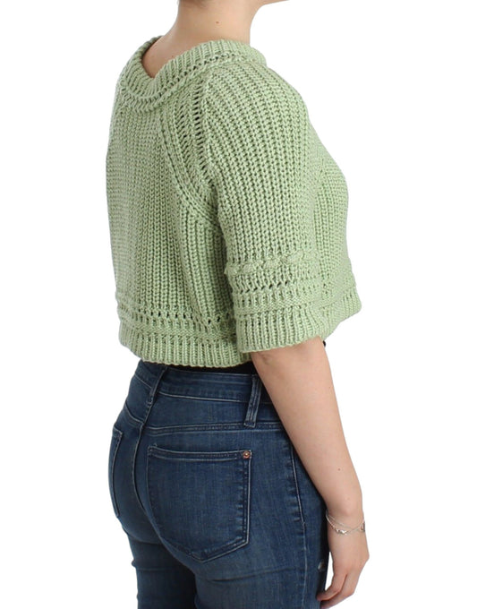 Woman wearing crocheted sweater and blue jeans