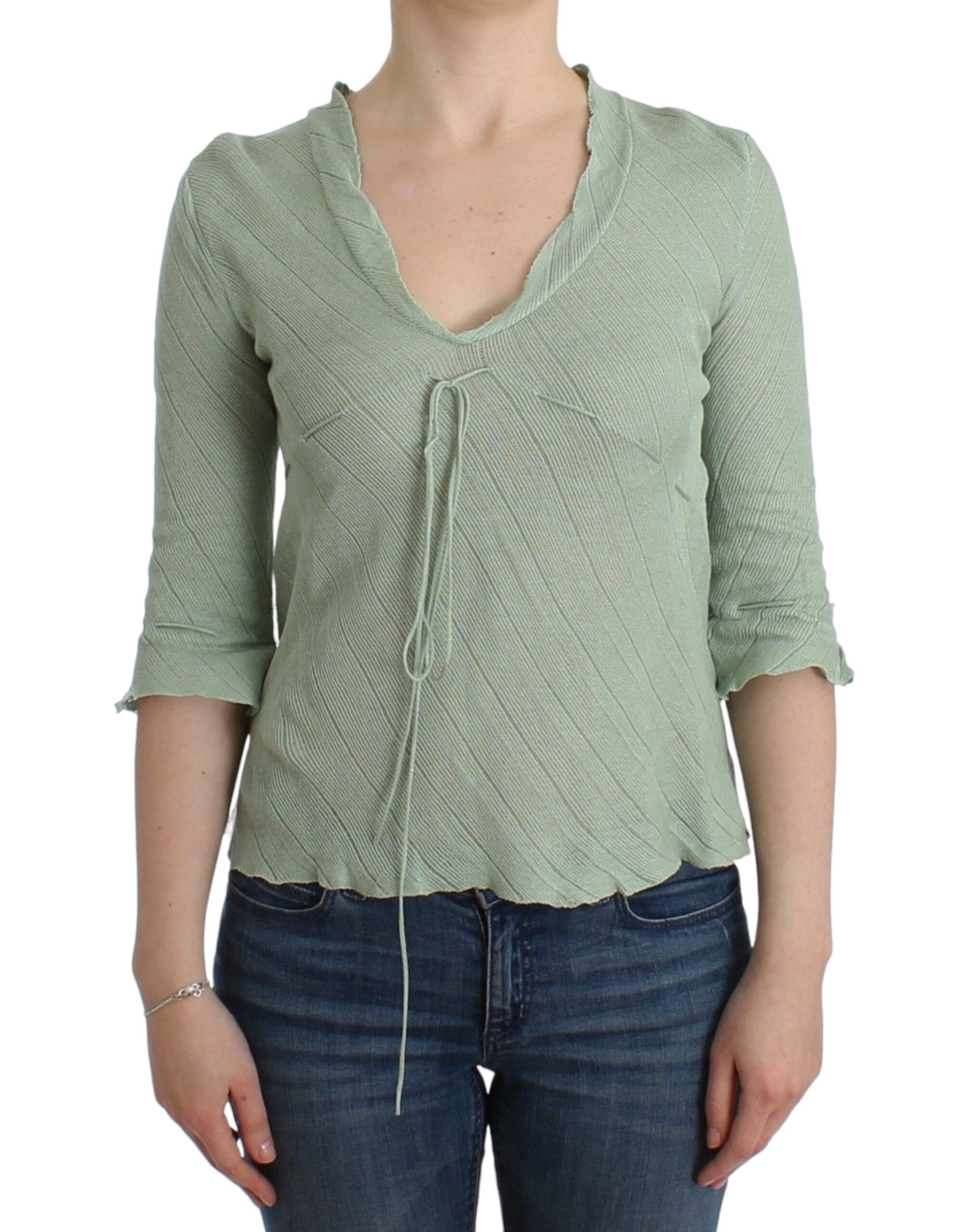 Woman wearing a light green long sleeve shirt