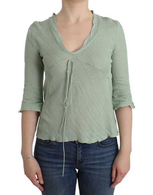 Woman wearing a light green long sleeve shirt