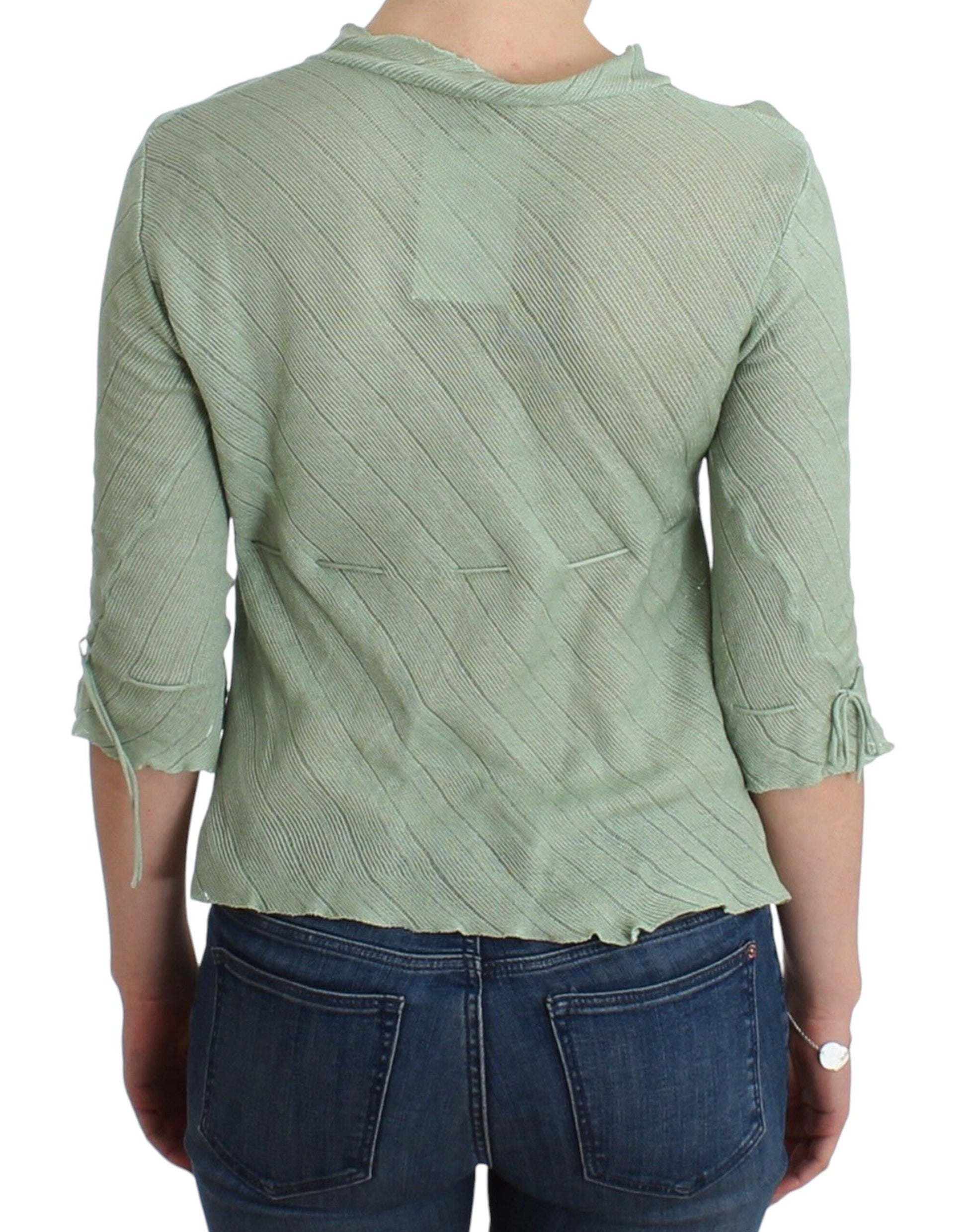 Green long sleeve shirt on a woman's back