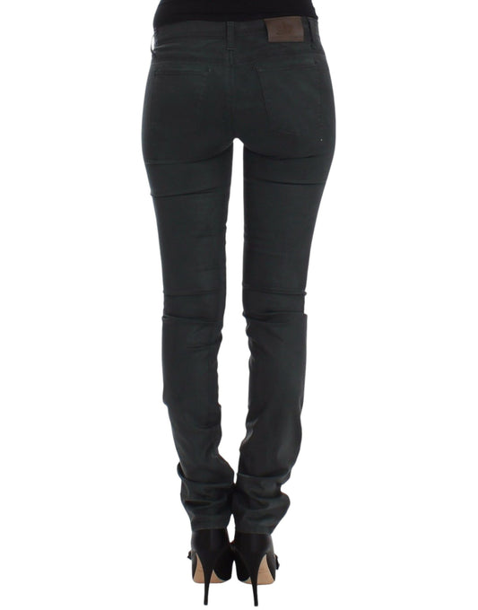 Pair of black skinny jeans with zipper detailing on legs