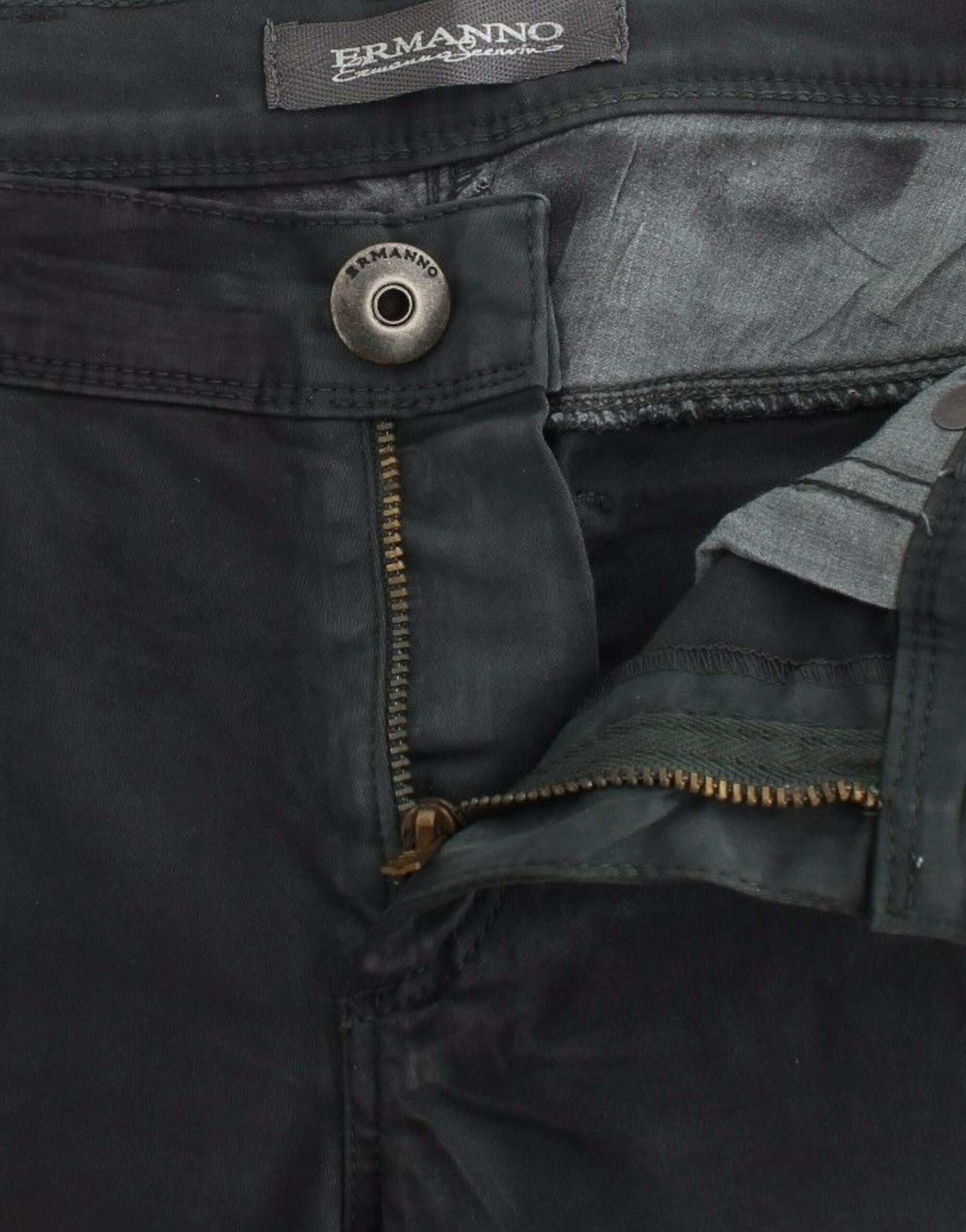 Pair of black jeans with button and zipper details