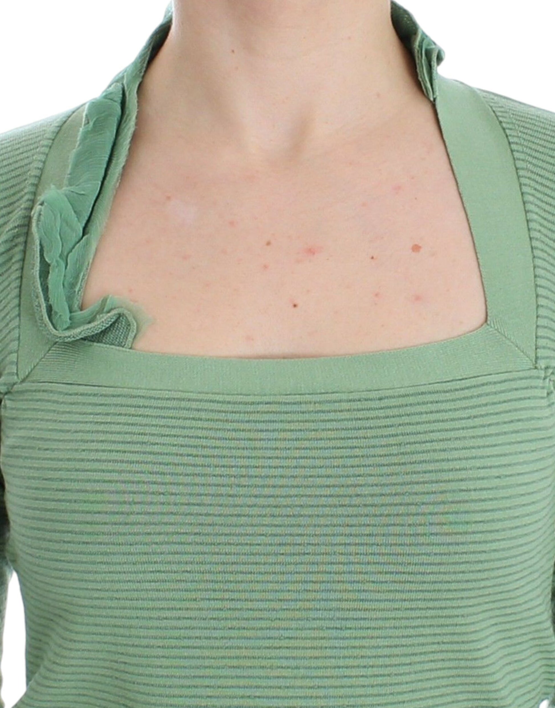 Green top on woman's torso