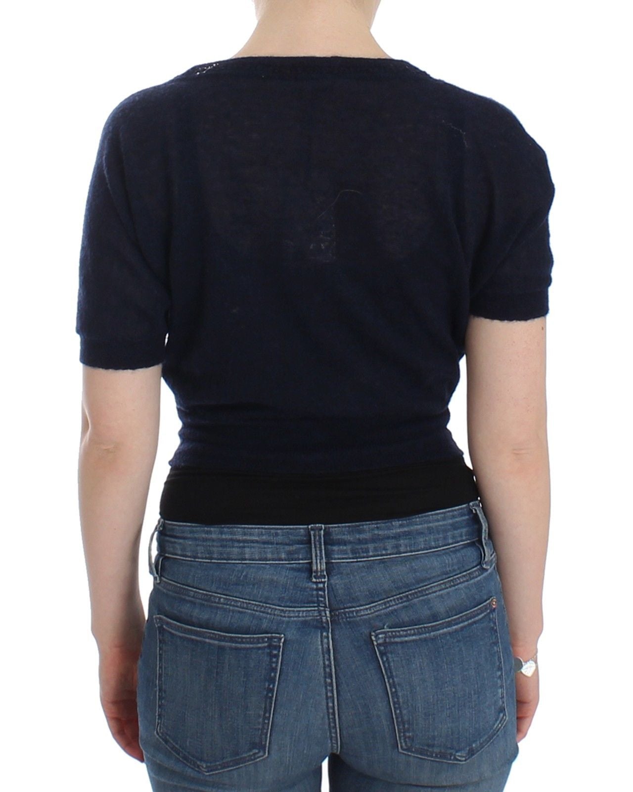 Woman wearing blue jeans and black shirt