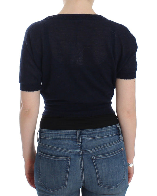 Woman wearing blue jeans and black shirt