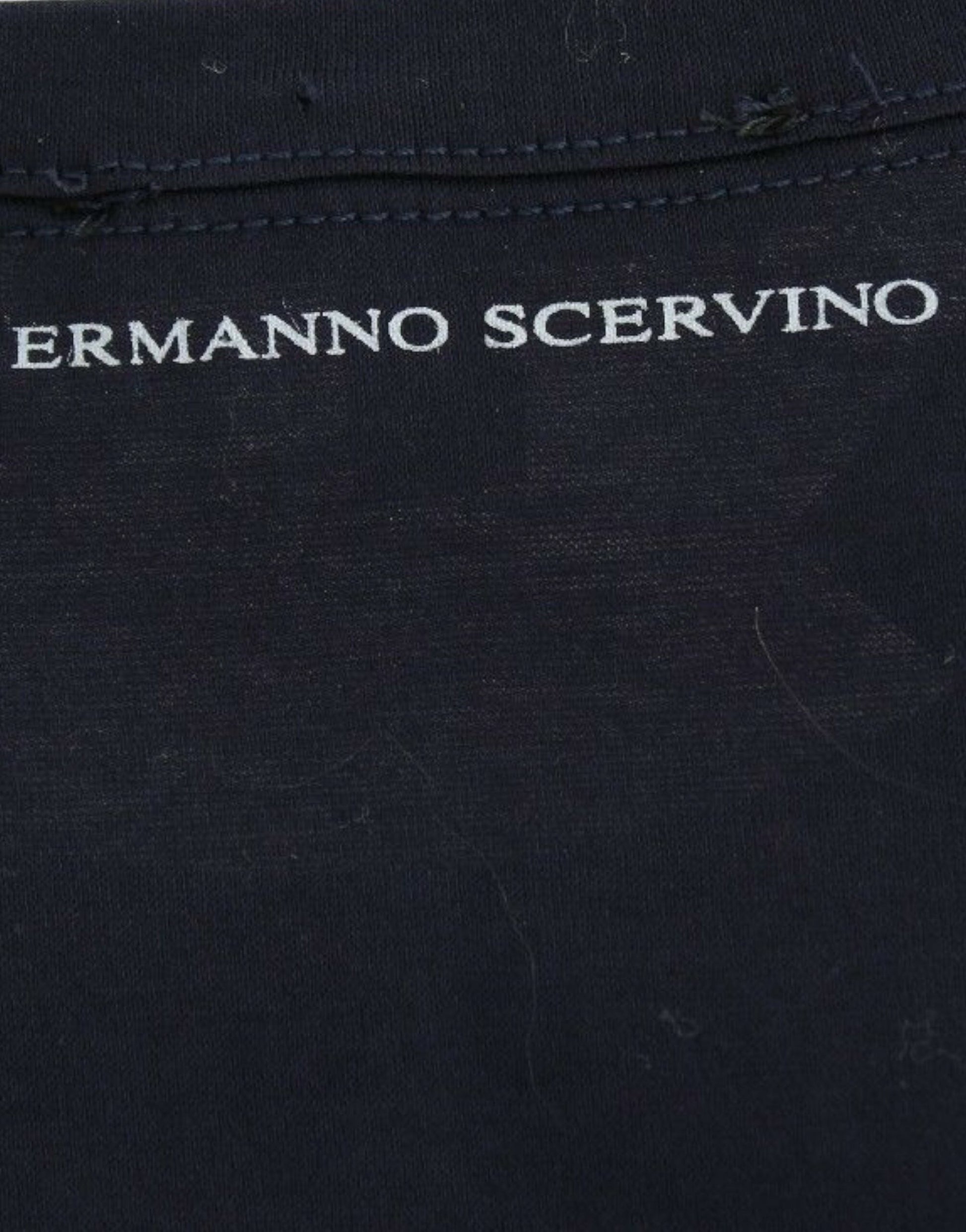 Black fabric with white embroidery on front