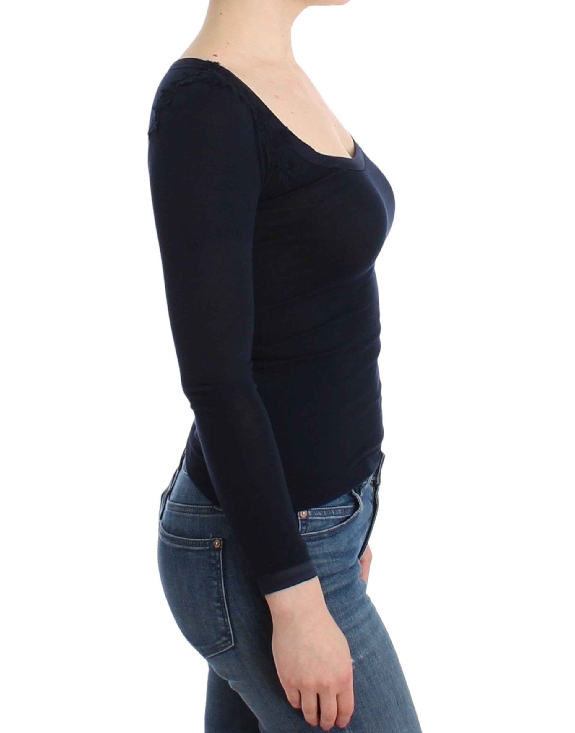 Woman wearing black top and blue jeans