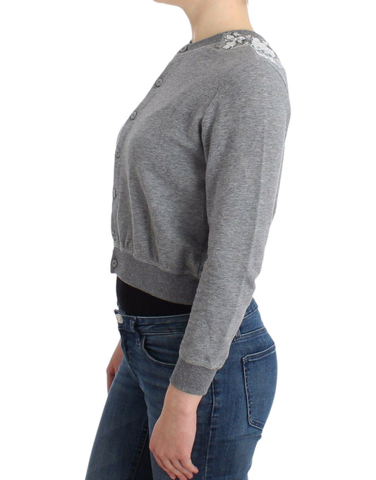 Woman wearing gray sweater and blue jeans