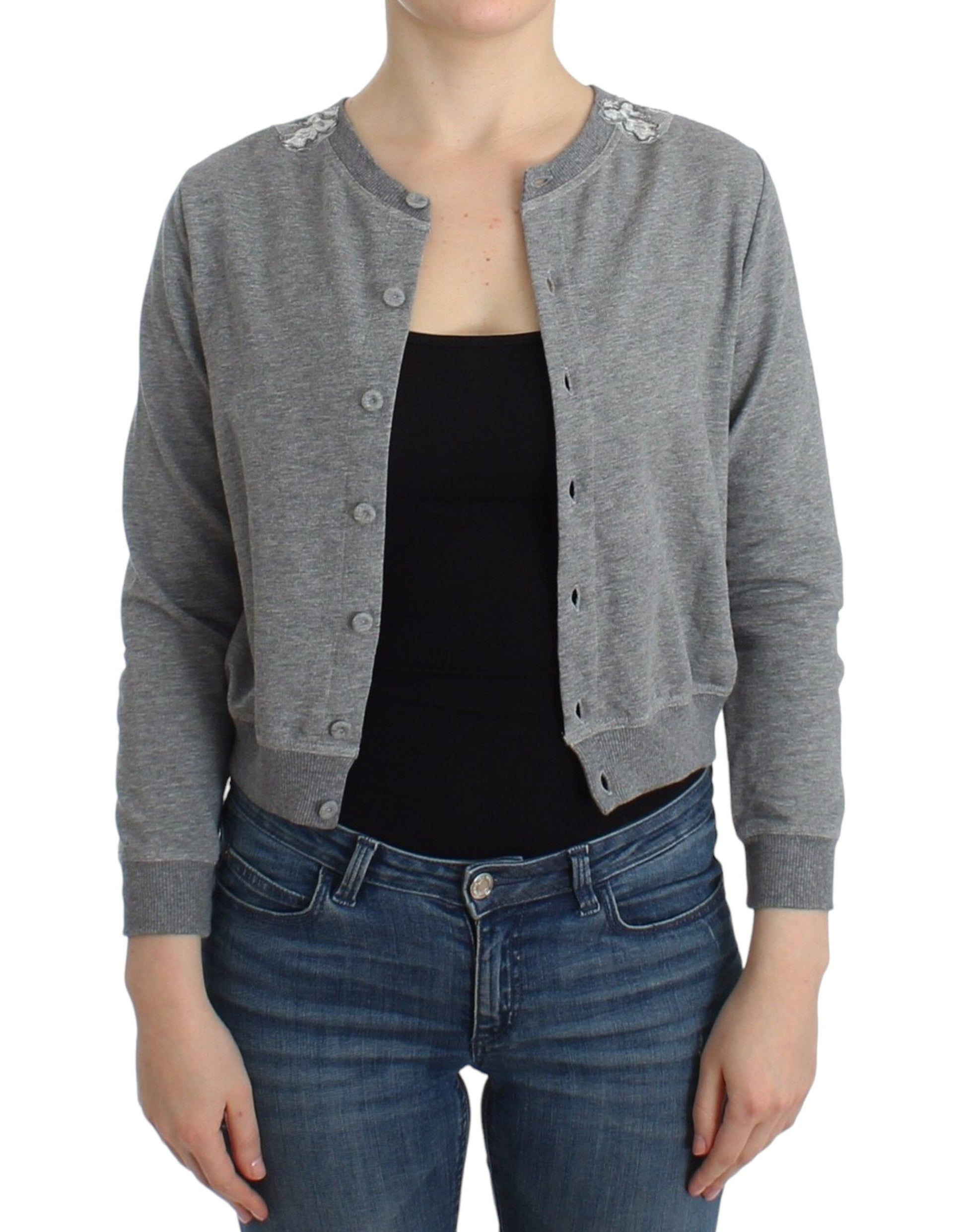 Woman wearing gray cardigan over black tank top