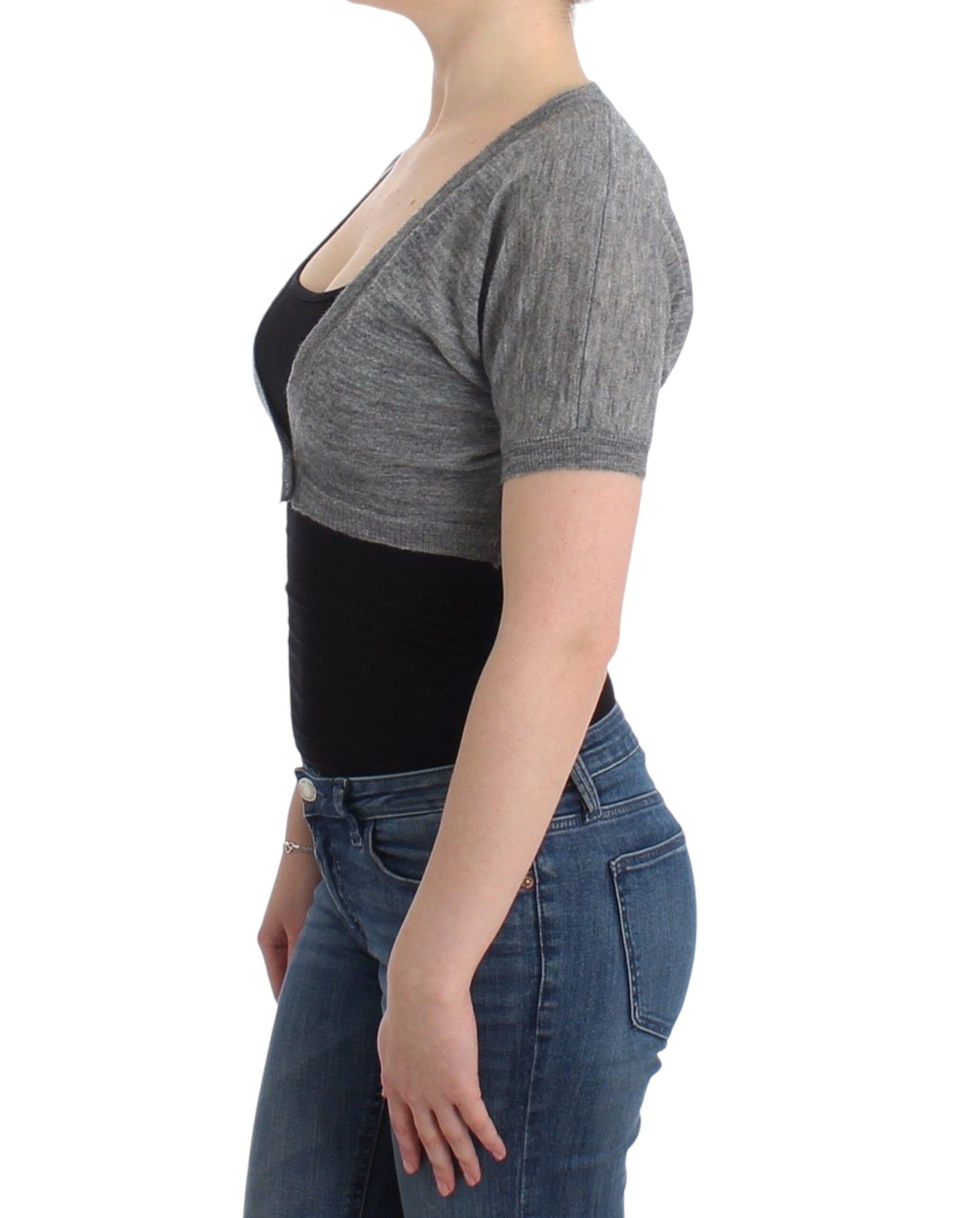 Woman wearing gray sweater and blue jeans