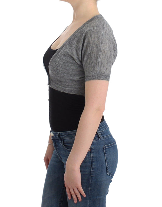 Woman wearing gray sweater and blue jeans