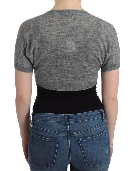 Woman wearing gray top and blue jeans