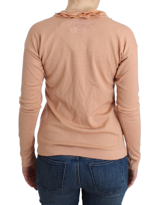 Long sleeve pink sweater on a person
