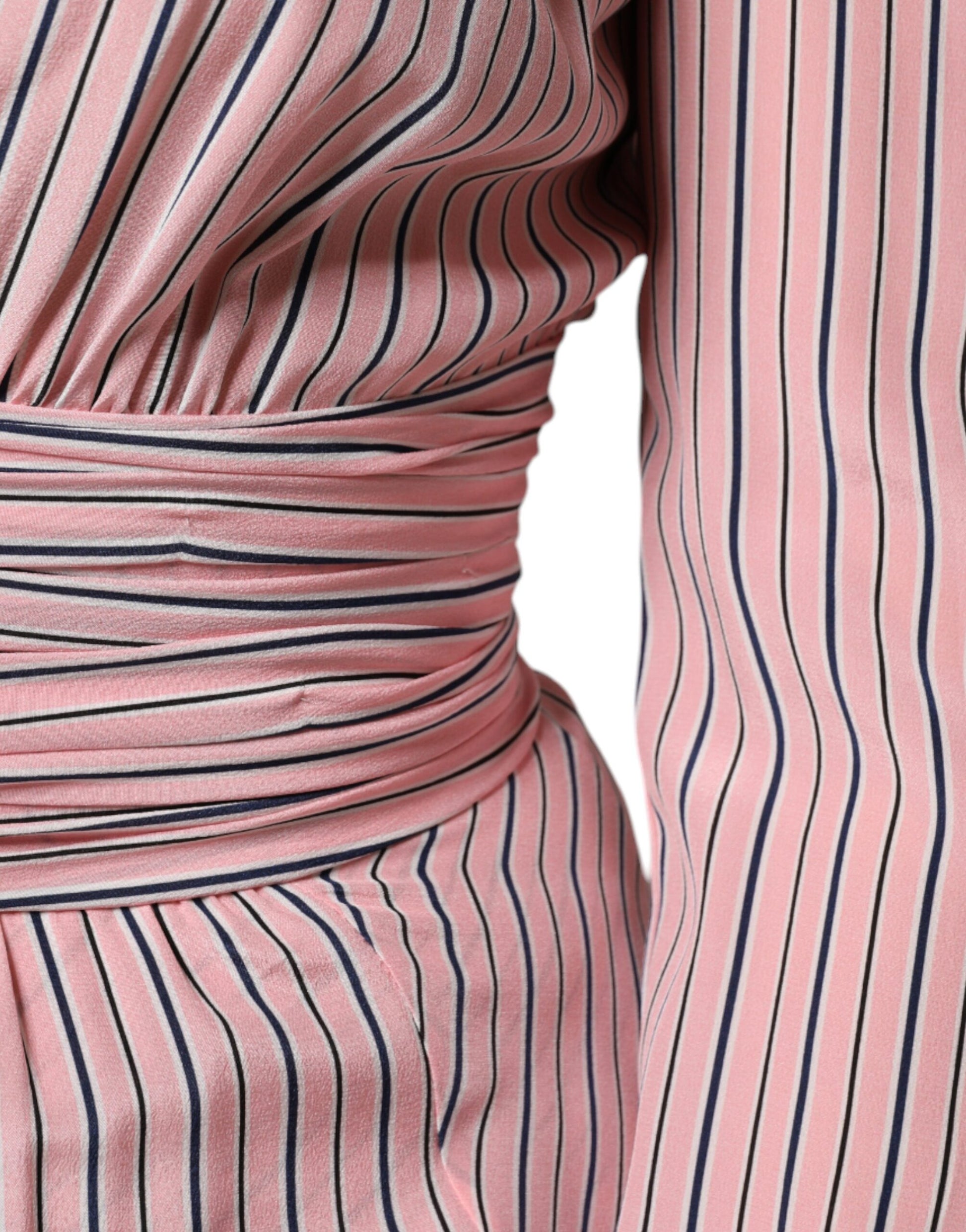 A pink and white striped midi dress with long sleeves