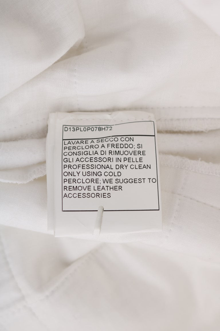 White tag on fabric with black writing indicating care instructions