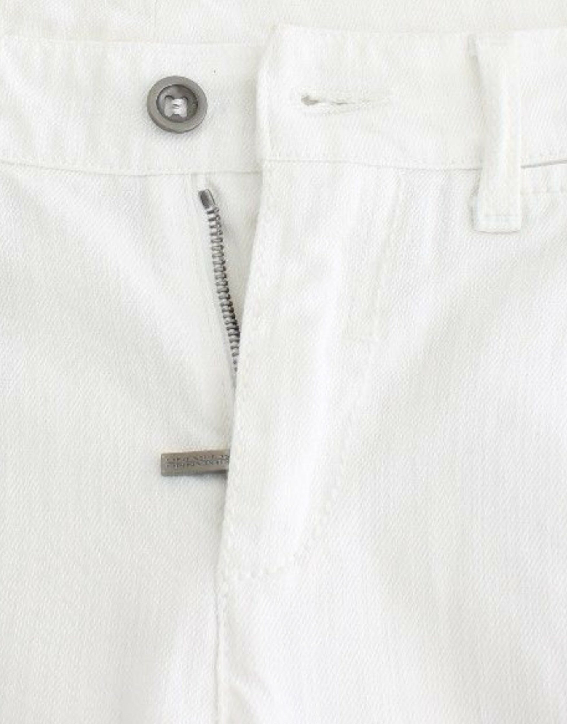 White pants with zipper and button closure