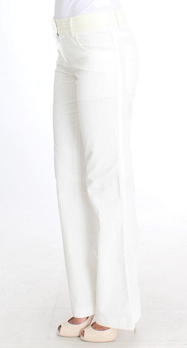 Woman wearing white pants and shoes