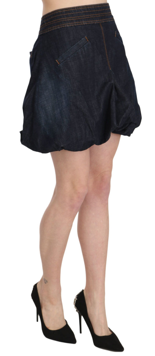 Woman wearing denim skirt and black heels