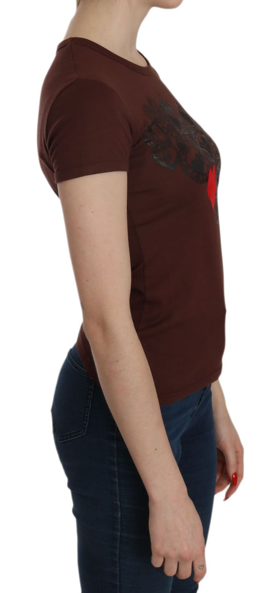 Woman wearing a maroon t-shirt with graphic design on front