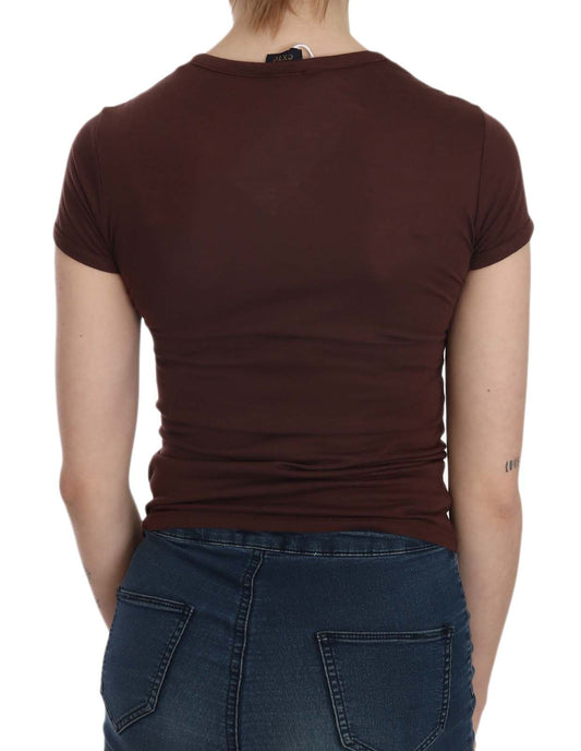 Woman wearing brown shirt and blue jeans
