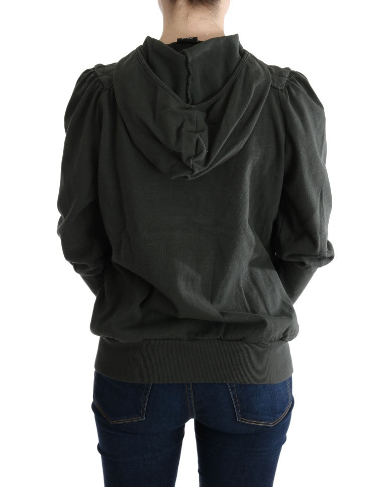 Woman wearing a dark hoodie with hood up