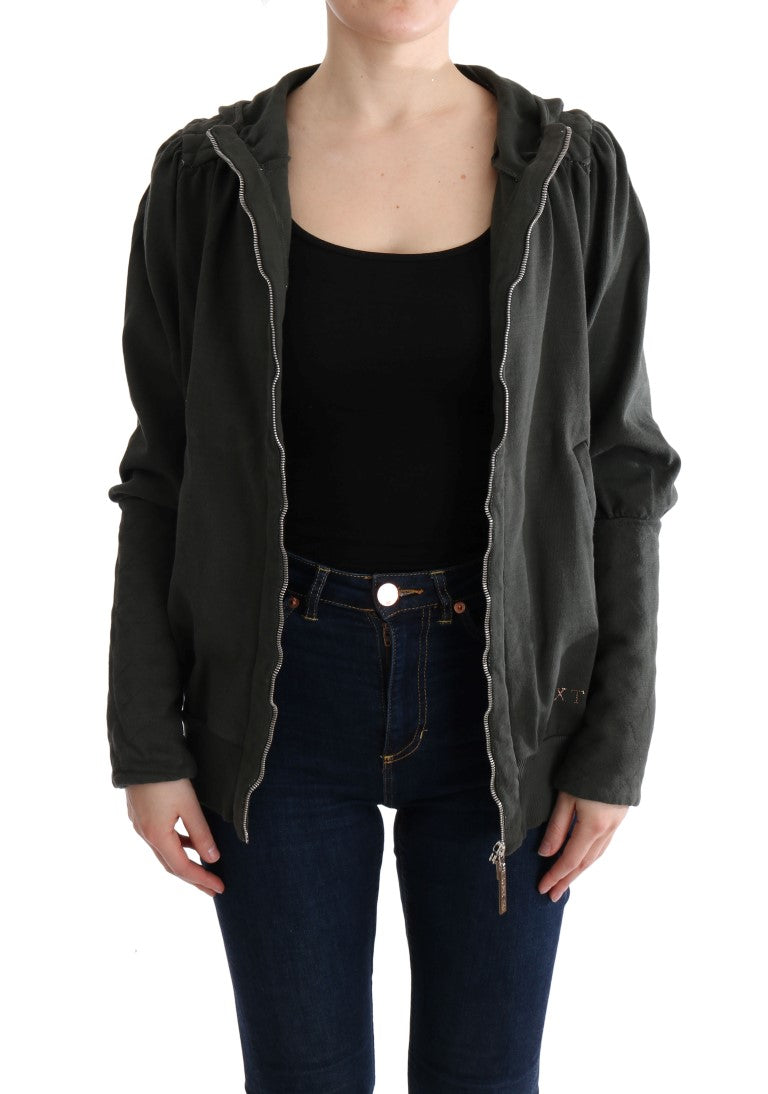 Woman wearing a black jacket over a striped shirt and blue jeans