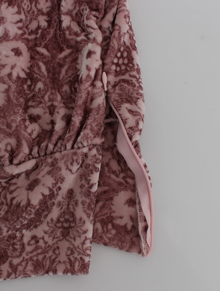 Pink floral blanket on white surface