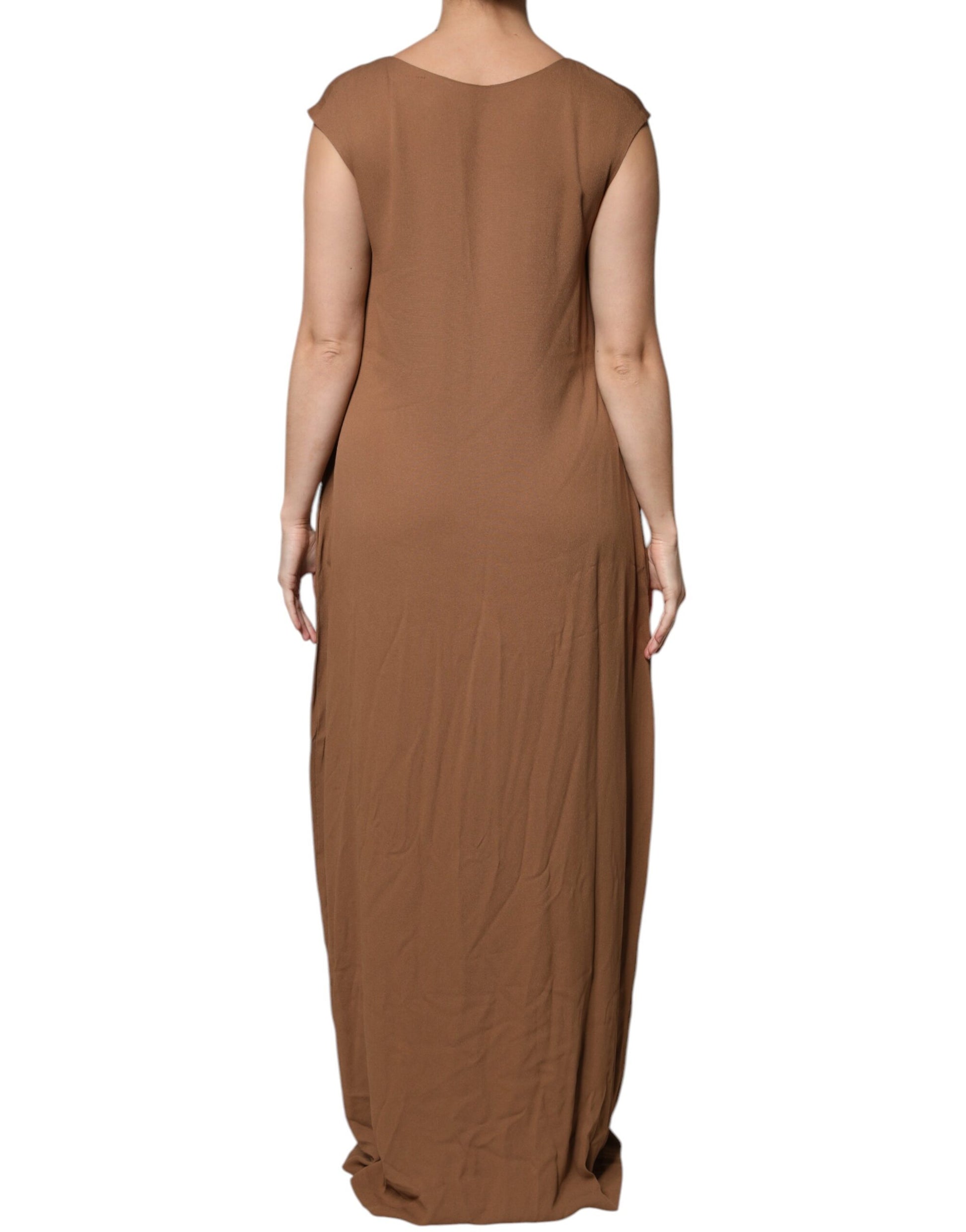 A long, sleeveless dress with a deep V-neck and an A-line silhouette. It is brown in color and appears to be