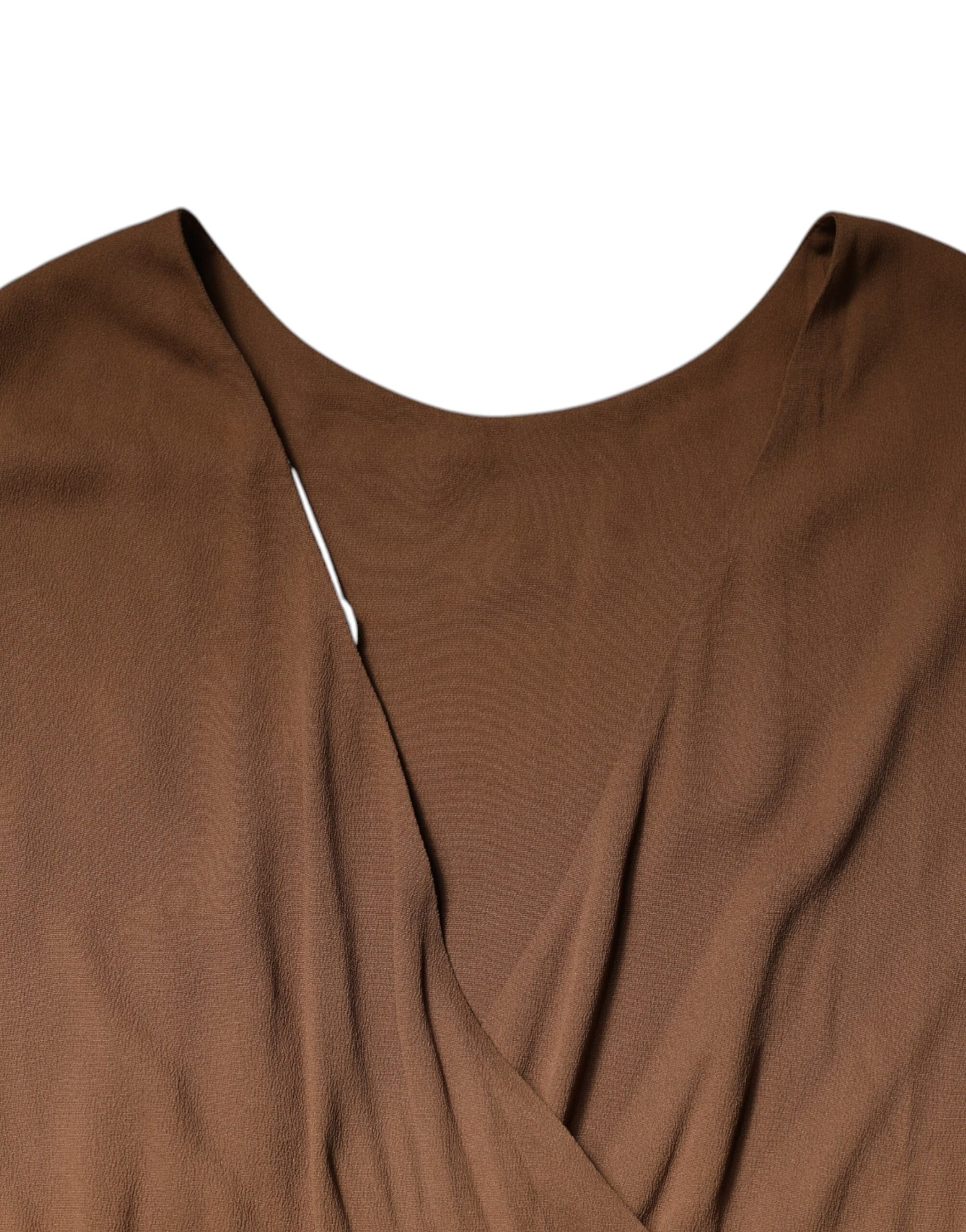 Brown sleeveless dress with deep V-neck and A-line silhouette
