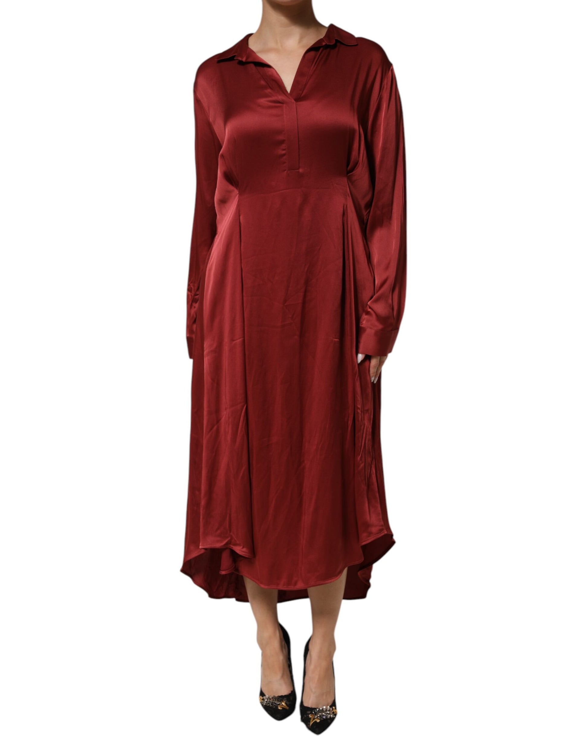 A long burgundy dress with a V-neckline and long sleeves
