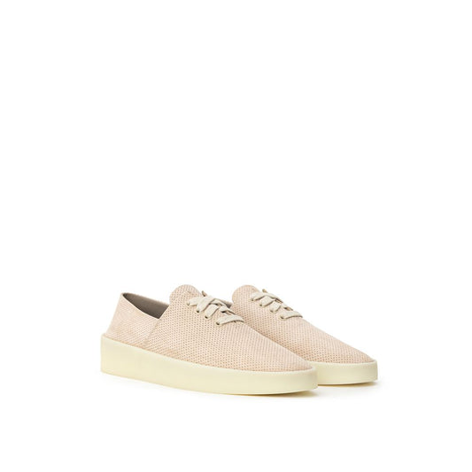 Pair of beige slip on shoes with chunky heels