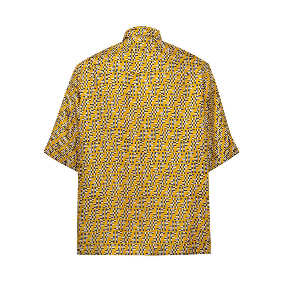 A yellow short sleeve shirt with a patterned design