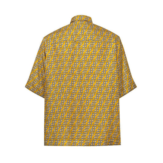 A yellow short sleeve shirt with a patterned design