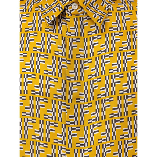 A yellow silk shirt with black and white geometric pattern