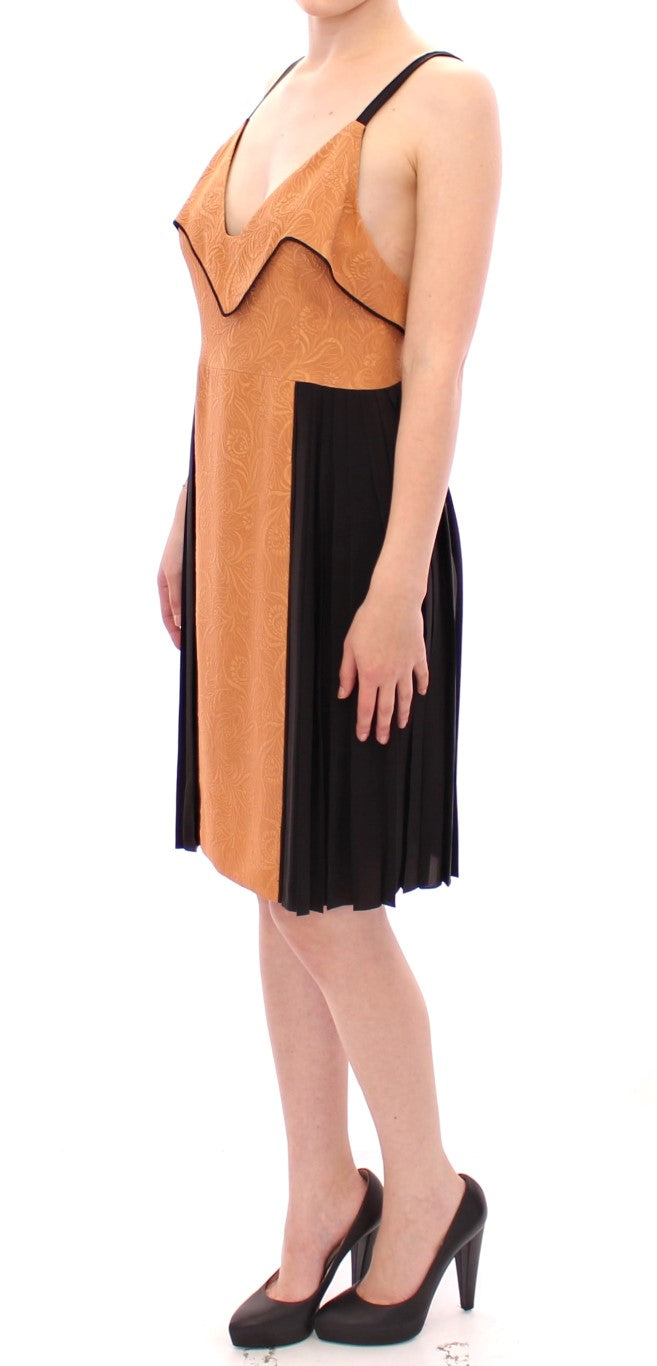Woman wearing a black and gold dress